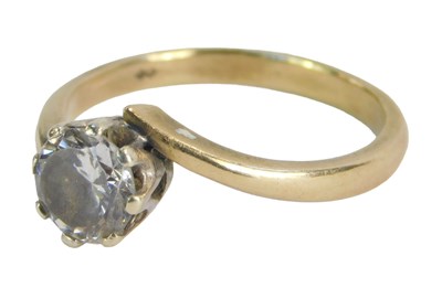 Lot 224 - A 9ct gold solitaire ring, set with a round...