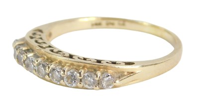 Lot 227 - A diamond half hoop dress ring, set with nine...