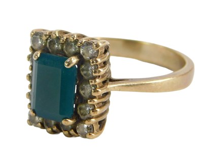 Lot 219 - An 18ct gold emerald and diamond dress ring,...
