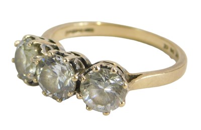 Lot 220 - A three stone cz dress ring, set with three...