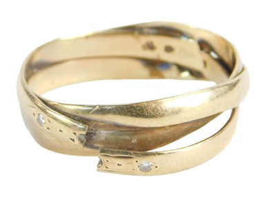 Lot 223 - A crossover ring, set with two tiny diamonds,...