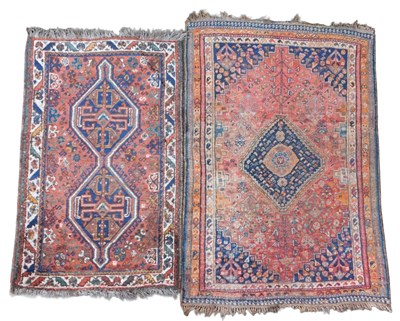 Lot 581 - A Turkish Heriz rug, red ground with a central...