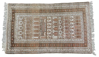 Lot 584 - A Baluch rug, cream ground, 139cm x 85cm.