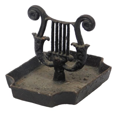 Lot 626 - A black painted cast iron boot scraper, the...