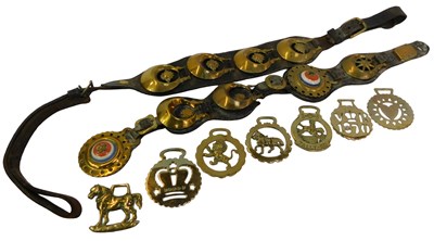 Lot 555 - Two brass leather-backed martingales, together...