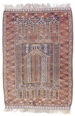 Lot 571 - An Afghan prayer rug, dark purple and red...