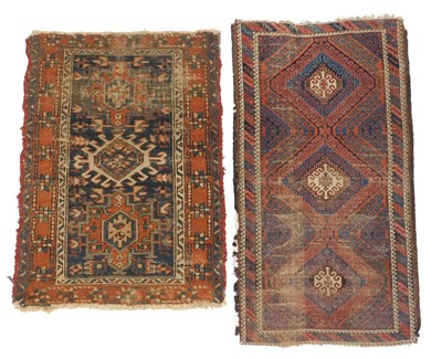 Lot 572 - A Persian Heriz rug, dark blue ground, with...