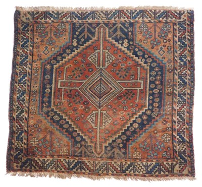 Lot 574 - A Turkish rug, red ground with a central...