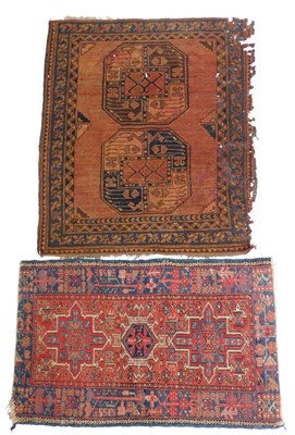 Lot 575 - A Persian rug, red ground, with three...