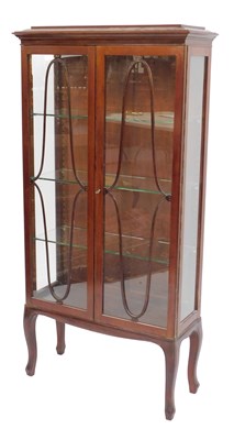 Lot 409 - An early 20thC walnut display cabinet, the top...