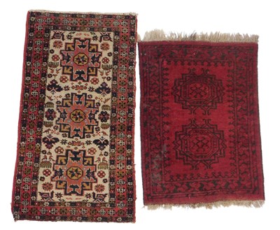 Lot 577 - A Caucasian rug, cream ground, with three...