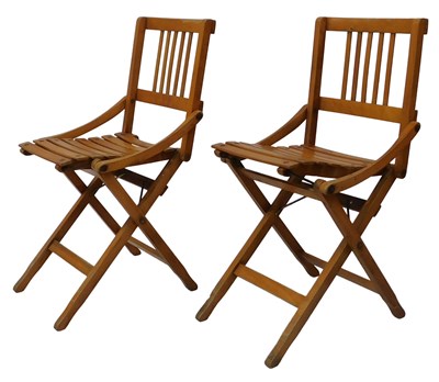 Lot 521 - A pair of Revetti Reguitti oak folding deck...