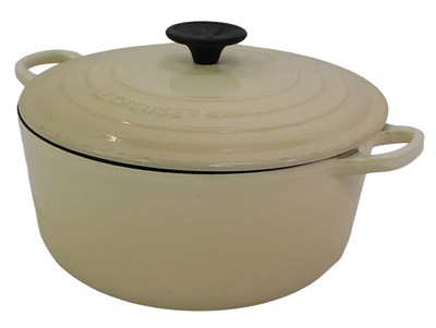 Lot 596 - A Le Creuset cream coloured cast iron...