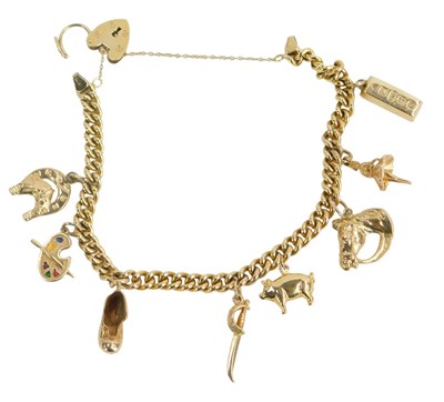 Lot 605 - A 9ct gold charm bracelet, with a thin curb...