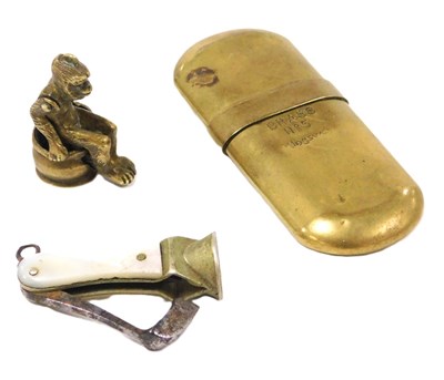 Lot 116B - Two cheroot cutters, and a brass lighter. (3)