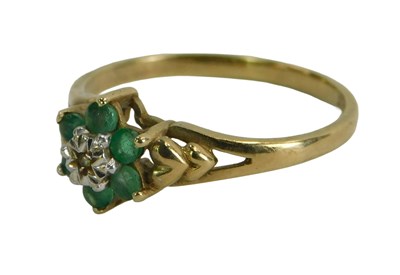 Lot 249a - A 9ct gold emerald and diamond flowerhead ring,...