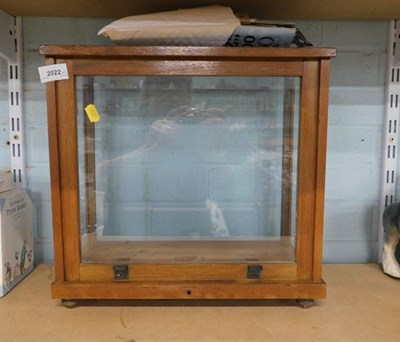Lot 2022 - A glass and wood display case, 36cm high, 39cm...