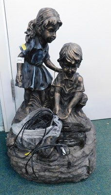 Lot 2052 - An outdoor water feature in bronze effect...