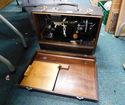 Lot 2067 - A cased Singer sewing machine, serial number...