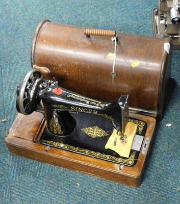 Lot 2096 - A cased Singer sewing machine, serial number...