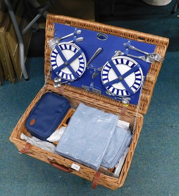 Lot 2100 - A wicker picnic basket, containing plates,...