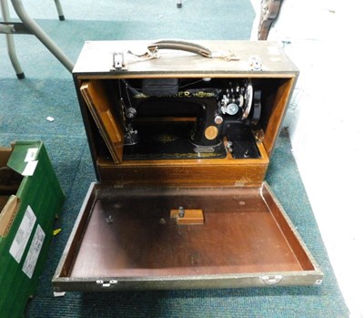 Lot 2170 - A cased Singer sewing machine.