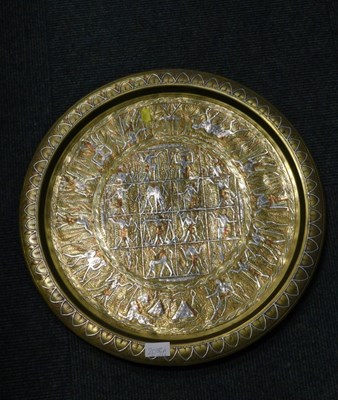 Lot 2088a - An Indian copper and brass hammered charger.