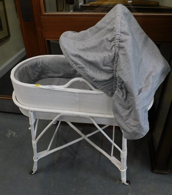 Lot 1539 - A Lloyd Loom style Moses Basket, on a matching...