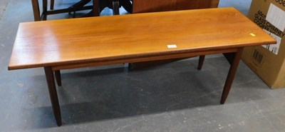 Lot 1542 - A mid century teak coffee table, on spindle legs.