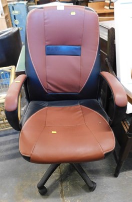 Lot 1551 - A brown and black leatherette swivel office...