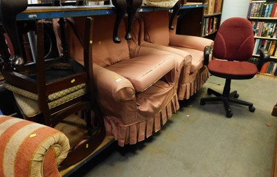 Lot 1584 - A pair of pink upholstered armchairs, together...