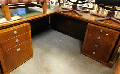 Lot 1586 - A large L shaped wooden office desk, with...