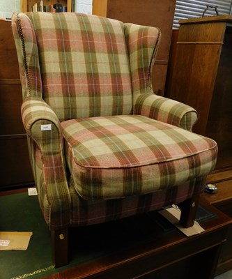 Lot 1587 - A high back easy chair, with tartan upholstery,...