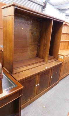 Lot 1591 - A two shelf open bookcase, over three...