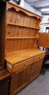 Lot 1592 - A pine kitchen dresser, three shelves to the...