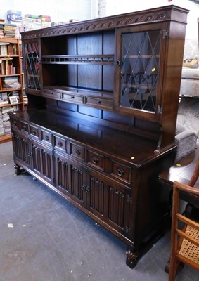 Lot 1597 - A mid oak Old Charm style kitchen dresser,...
