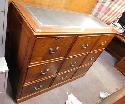 Lot 1601 - A nine drawer wooden office filing cabinet,...
