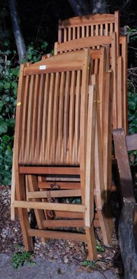 Lot 1651 - Six folding teak garden chairs.