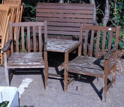 Lot 1652 - A wooden twin seat, with integral table,...