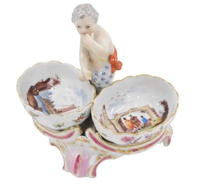Lot 461 - A Dresden porcelain salt, centred by a child...
