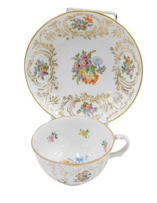 Lot 475 - A Dresden cup and saucer, on a white ceramic...