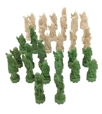 Lot 476 - A resin chess set, of gnomes in green and cream.