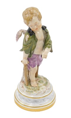 Lot 491 - A late Meissen ceramic figure of a boy, with...
