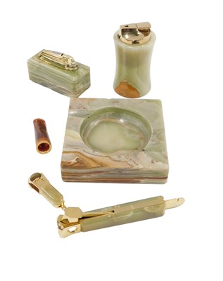 Lot 495 - An onyx square set ashtray, two cigar cutters,...
