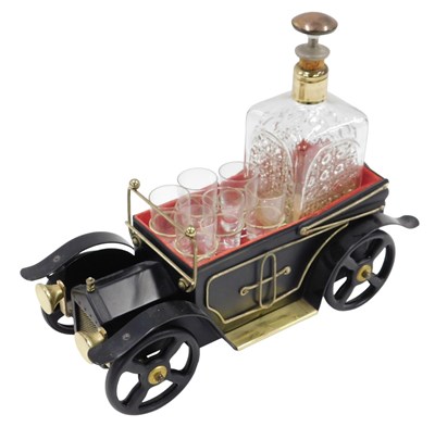 Lot 501 - A novelty metal car decanter set, with...