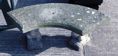 Lot 1665 - A curved two seater reconstituted stone garden...