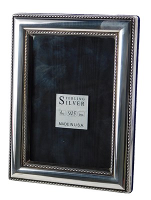 Lot 573 - A silver photograph frame, with rope twist...