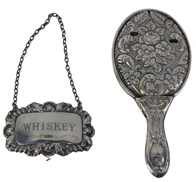 Lot 566 - A silver whisky decanter label, and a white...