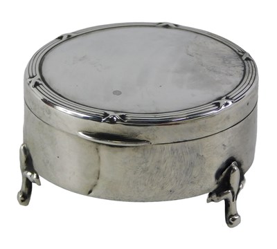 Lot 564 - An Edwardian silver jewellery box, circular...