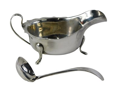 Lot 561 - Two items of silver, comprising a silver milk...